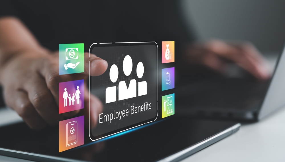 Hand touching virtual screen with employee benefits icons, corporate HR management, compensation, health insurance, work life balance and digital payroll systems. Workplace wellness.
